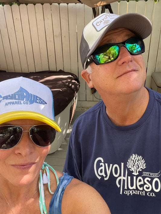 Couple in Key West, him in the Spread the Word navy tee