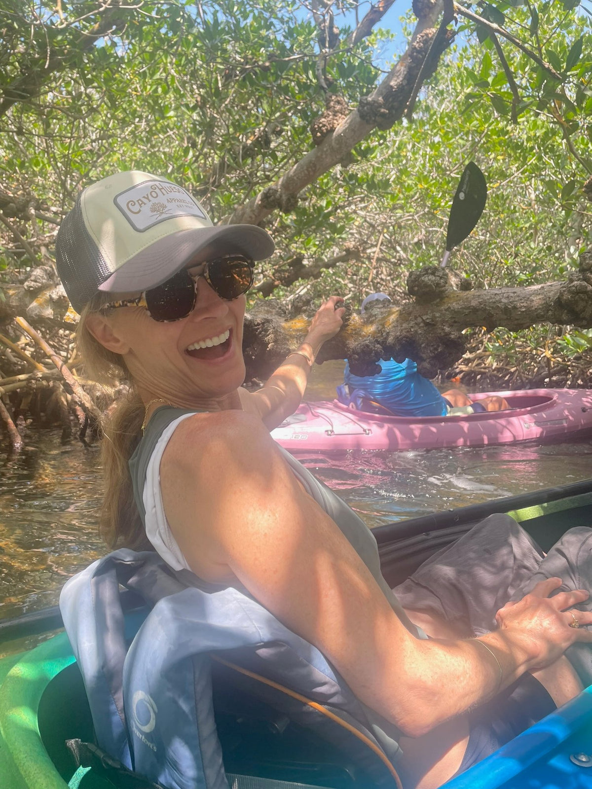 Classic Logo gray trucker hat worn while kayaking in the mangroves